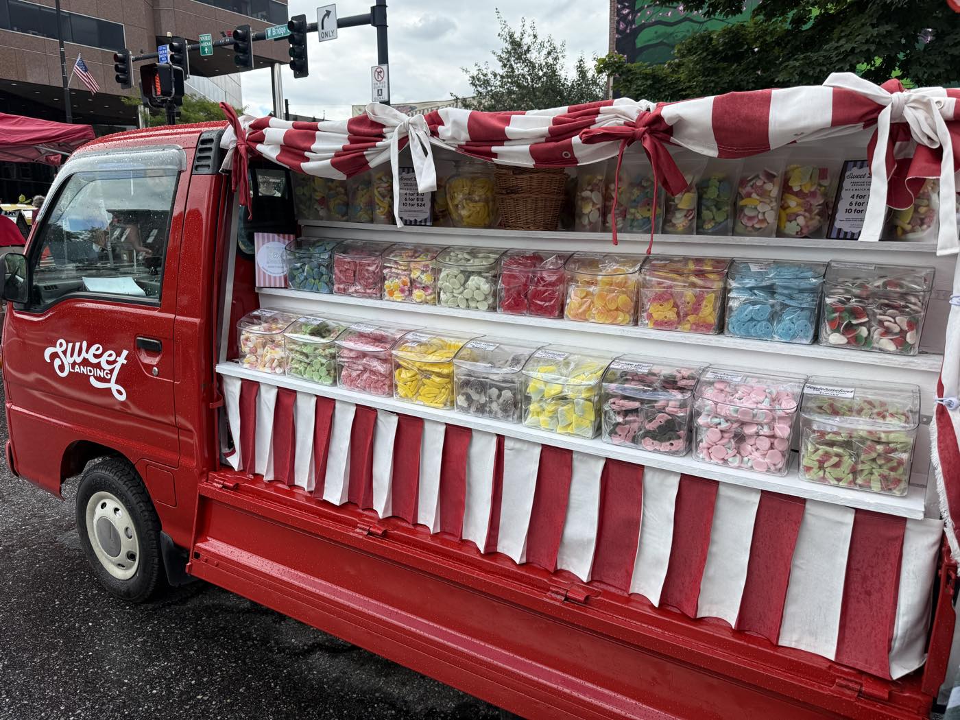 Sweetie from the side, three shelves of sweets on show